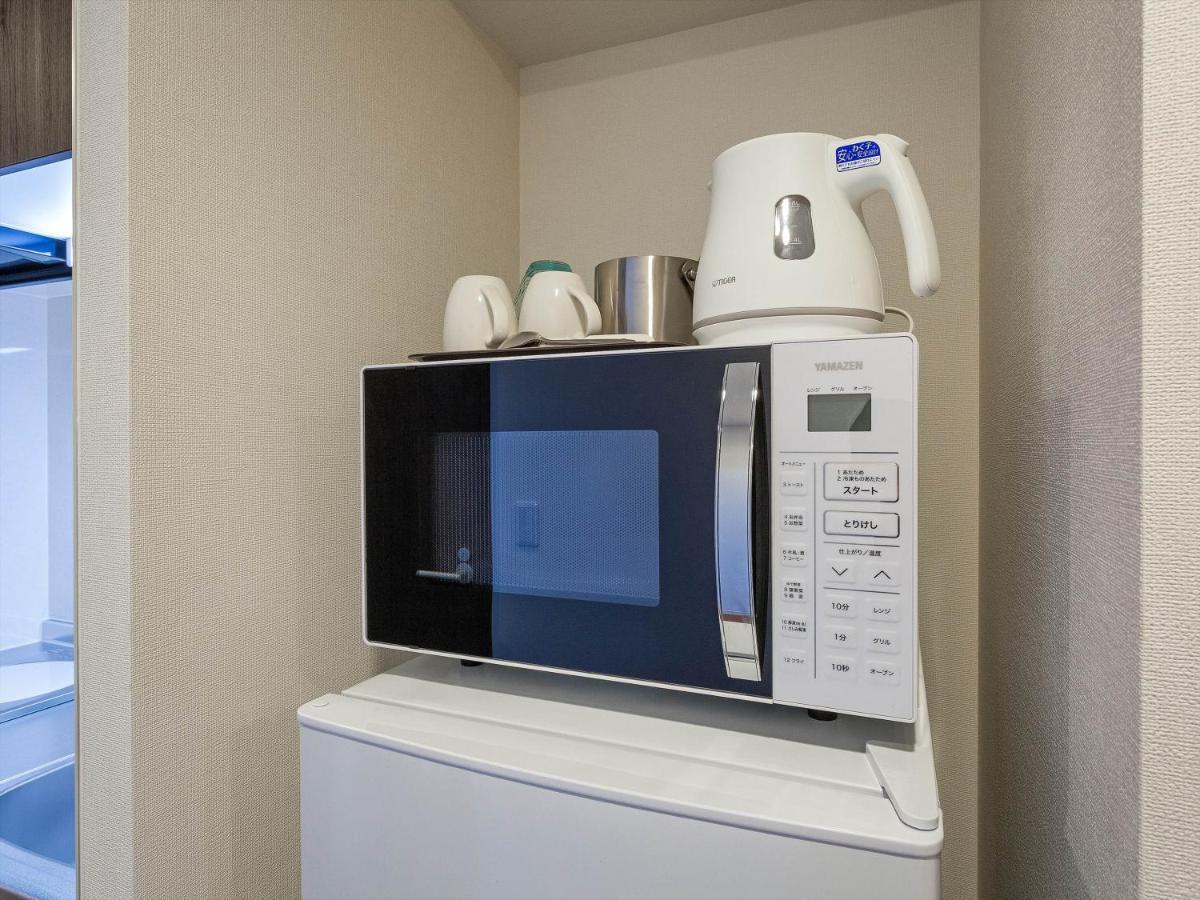 Living Inn Asahibashiekimae Premier Наха Экстерьер фото